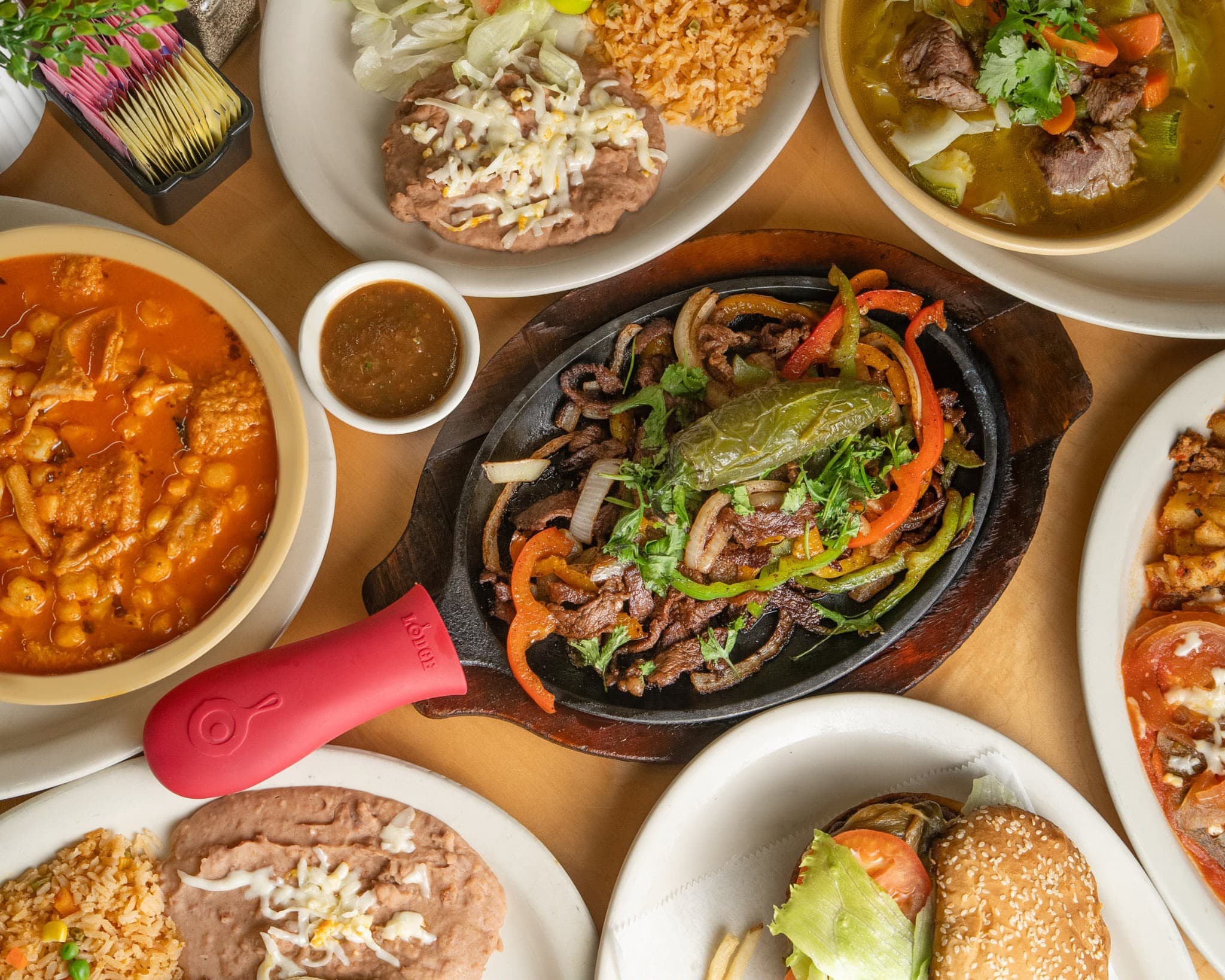 A table full of Don Porfirio Mexican dishes